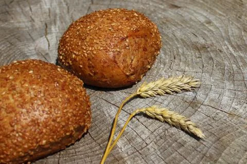Rolls and wheat Stock Photos