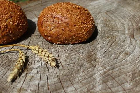Rolls and wheat Stock Photos
