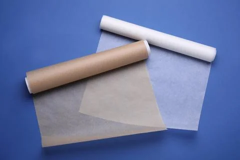 Rolls of baking paper on blue background, top view Stock Photos