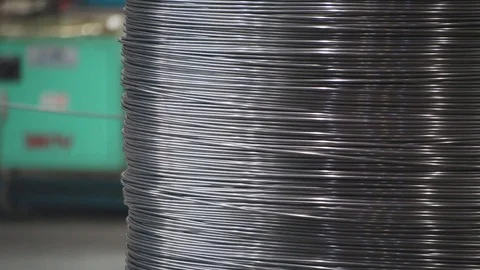 Rolls of barbed wire . wound wire at the factory. Iron break wound in a large Stock Footage 94898718