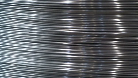Rolls of barbed wire . wound wire at the factory. Iron break wound in a large Stock Footage 94898747