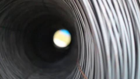 Rolls of barbed wire . wound wire at the factory. Iron proloco wound into large Stock Footage 94898818