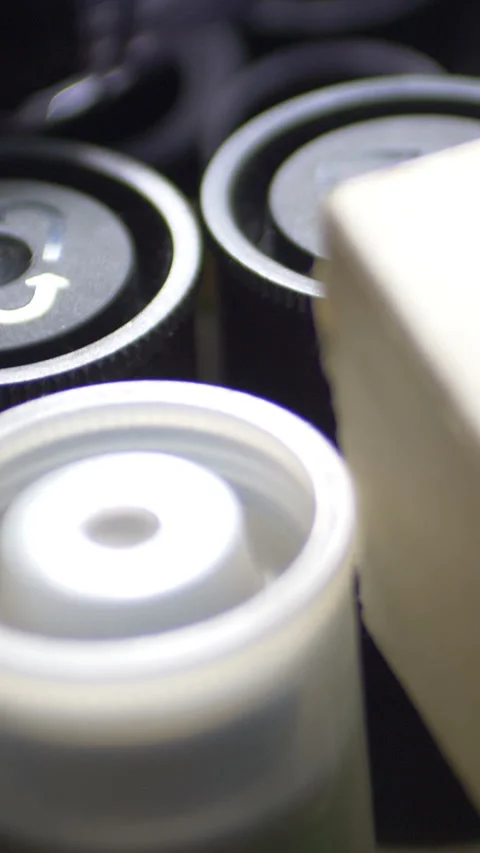 Rolls Of Black And White Negative Film  vertical video Stock Footage 255805840