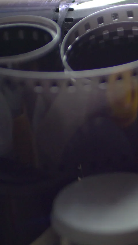 Rolls Of Black And White Negative Film vertical video Stock Footage 256102829