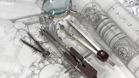 Rolls of blueprints - magnifier, compasses Stock Footage 94534338