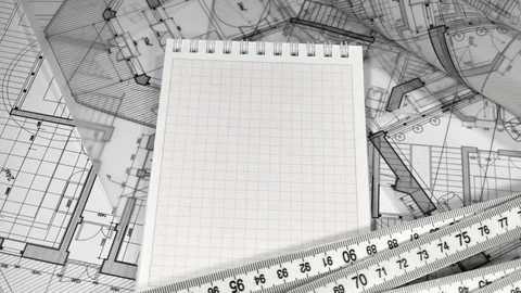 Rolls of blueprints, notepad, yardstick - folding ruler Stock Footage 94457529