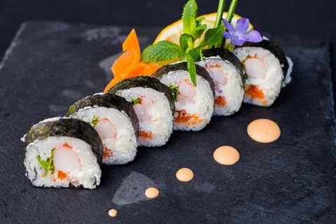 Rolls with caviar on a plate Stock-Fotos
