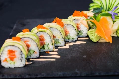 Rolls with caviar on a plate Stock Photos