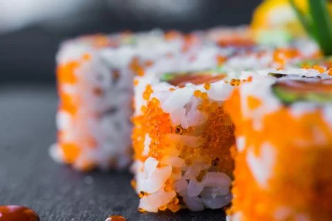 Rolls with caviar on a plate Stock Photos