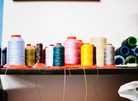 Rolls of colored cotton thread for sewing with machine Stock Photos