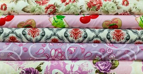 Rolls of colored fabrics Stock Photos