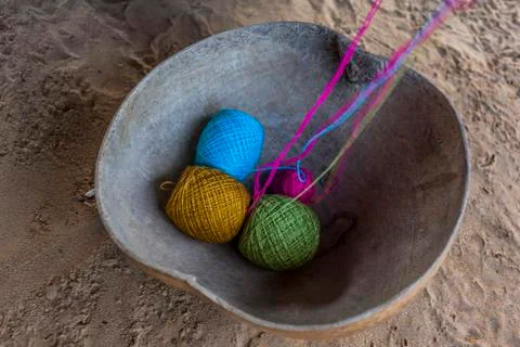 Rolls of colored thread in a calabash shell Stock Photos