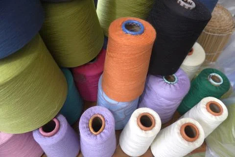 Rolls of colorful Threads, threads on tubes, cotton, wool. Pile of colored linen Stock Photos