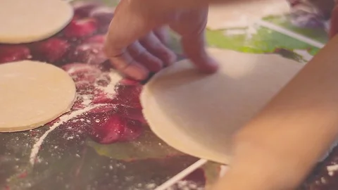 Rolls the dough with a rolling pin Stock Footage 78233903
