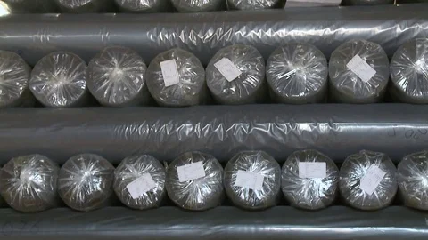 Rolls of fabrics are stored in the raw materials warehouse, warehouse of fabrics Stock Footage 81240091