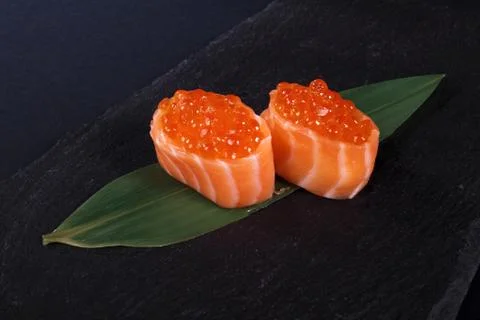 Rolls with fish eggs on leaf green Stock Photos
