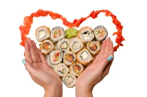Rolls in form heart with hands Stock Photos