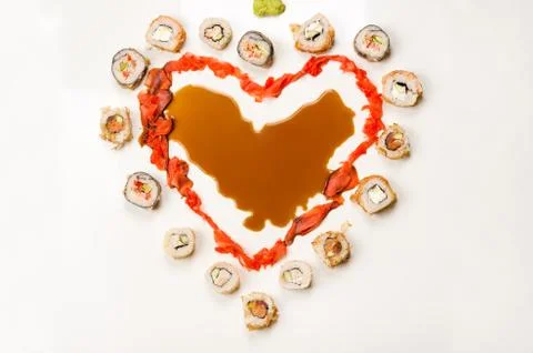 Rolls in form heart on table Stock Photos