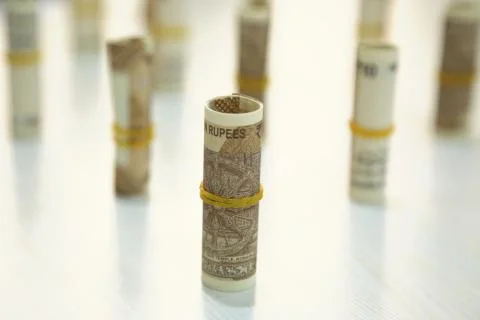 Rolls of Indian 10 rupee notes Stock Photos