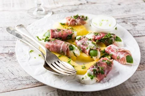 Rolls of mozzarella, basil and Parma ham 스톡 사진