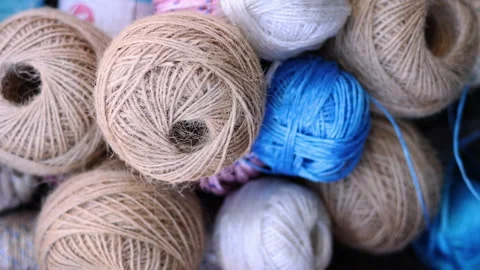 Rolls of natural hemp wire for parcel twine, string, packing or diy Stock Footage 253383786