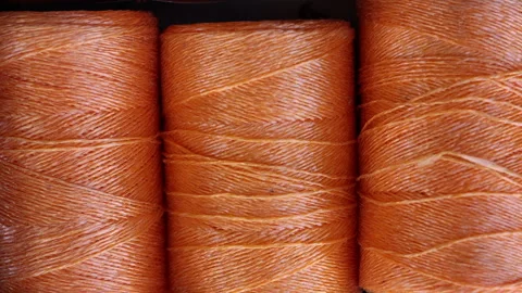 Rolls of natural hemp wire for parcel twine, string, packing or diy Stock Footage 253384504