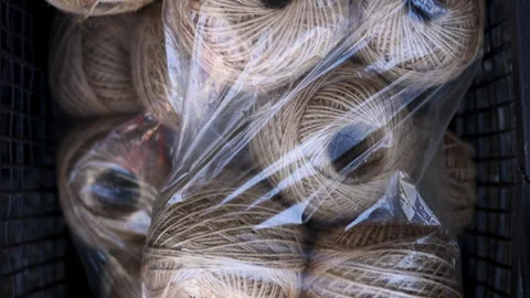 Rolls of natural hemp wire for parcel twine, string, packing or diy Stock Footage 253384957