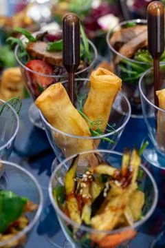 Rolls of pancakes with stuffing on the buffet Stock Photos