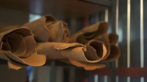 Rolls of real brown leather are in modern workshop. Stock Footage 94757902