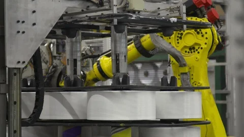 Rolls of recycled plastic threads with robot arm Stock Footage 93531266