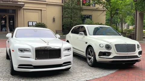 A Rolls Royce and Bentley cars parked Stock Video Pond5