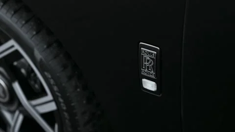 Rolls Royce Emblem on the Fender of a Black Car Stock Footage 320153574