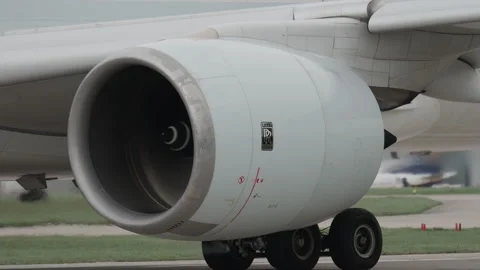 Rolls Royce engines on airplane close up starting up before takeoff Stock Footage 271215712