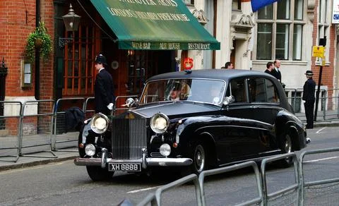 A Rolls Royce Limousine Displaying a Crest of the Royal Family Stock Photos