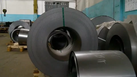Rolls of sheet steel for press forming of products in the factory. Stock Footage 265097216