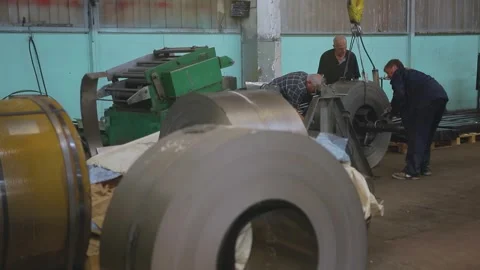 Rolls of sheet steel for press forming of products in the factory. Stock Footage 269674582