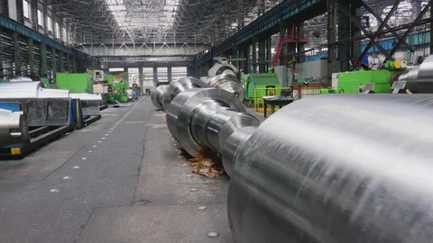 Rolls of steel lie on floor in production workshop of plant. Manufacture of s Stock Footage
