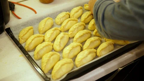 Rolls stuffed mince Beef on Tray ready to cook in oven. Chef preparing Bun. Stock-Footage 129458233