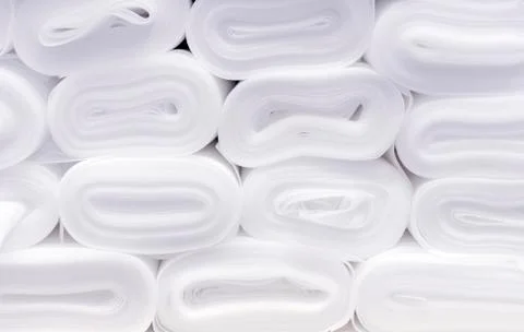 Rolls with a substrate for laminate on the counter of the construction store. Stock Photos