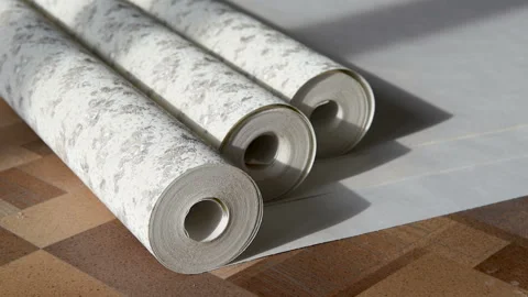 Rolls of wallpaper and roller. Stock Footage 104760171