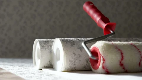 Rolls of wallpaper and roller. Stock Footage 104760257