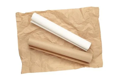 Rolls of white and brown baking paper isolated on white background Stock Photos