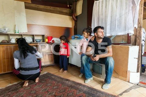 Roma Man And His Family At Their Home.