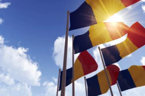 Romaina flags waving in the wind against a blue sky. 3D Rendering Illustrazione stock