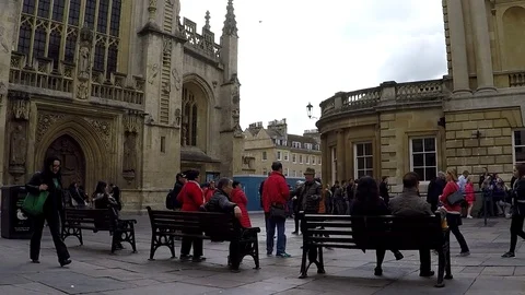 The Roman Baths and The Bath Abbey in city of Bath, Somerset, England, UK Stock Footage 77865527