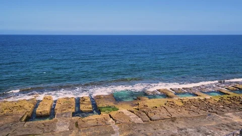 The Roman baths in Sliema (Malta), man made pools in the rocky beaches Stock Footage 109258761