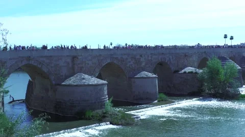 Roman Bridge Pan Across River in Cordoba Spain During Daytime Stock Footage 335989974