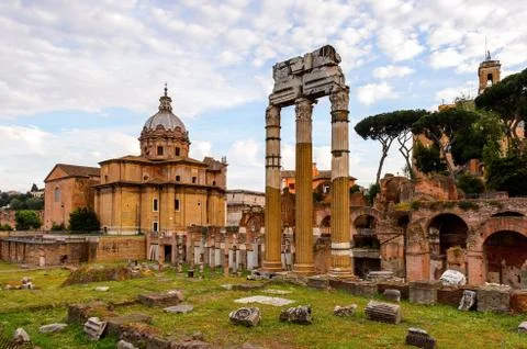 Roman Forum in the evening, a rectangular forum surrounded by the ruins of se Stock Photos
