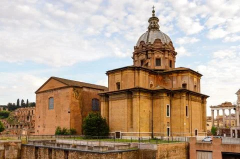 Roman Forum in the evening, a rectangular forum surrounded by the ruins of se Stock Photos