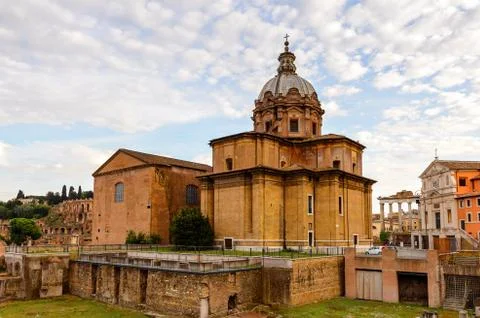 Roman Forum in the evening, a rectangular forum surrounded by the ruins of se Stock Photos